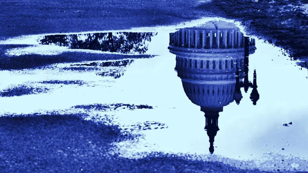 Congress displayed in a puddle upside down. Photo: Shutterstock