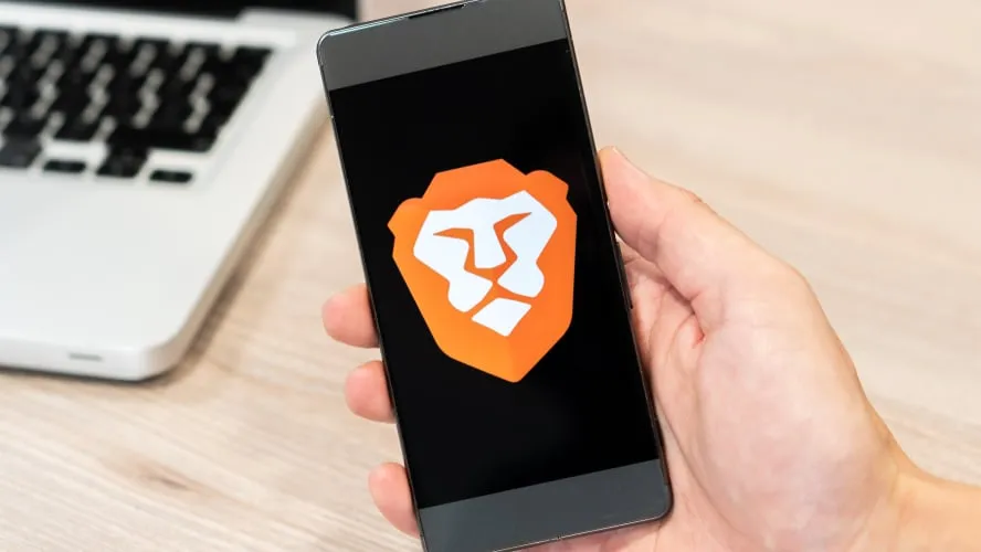 a phone with the Brave browser logo