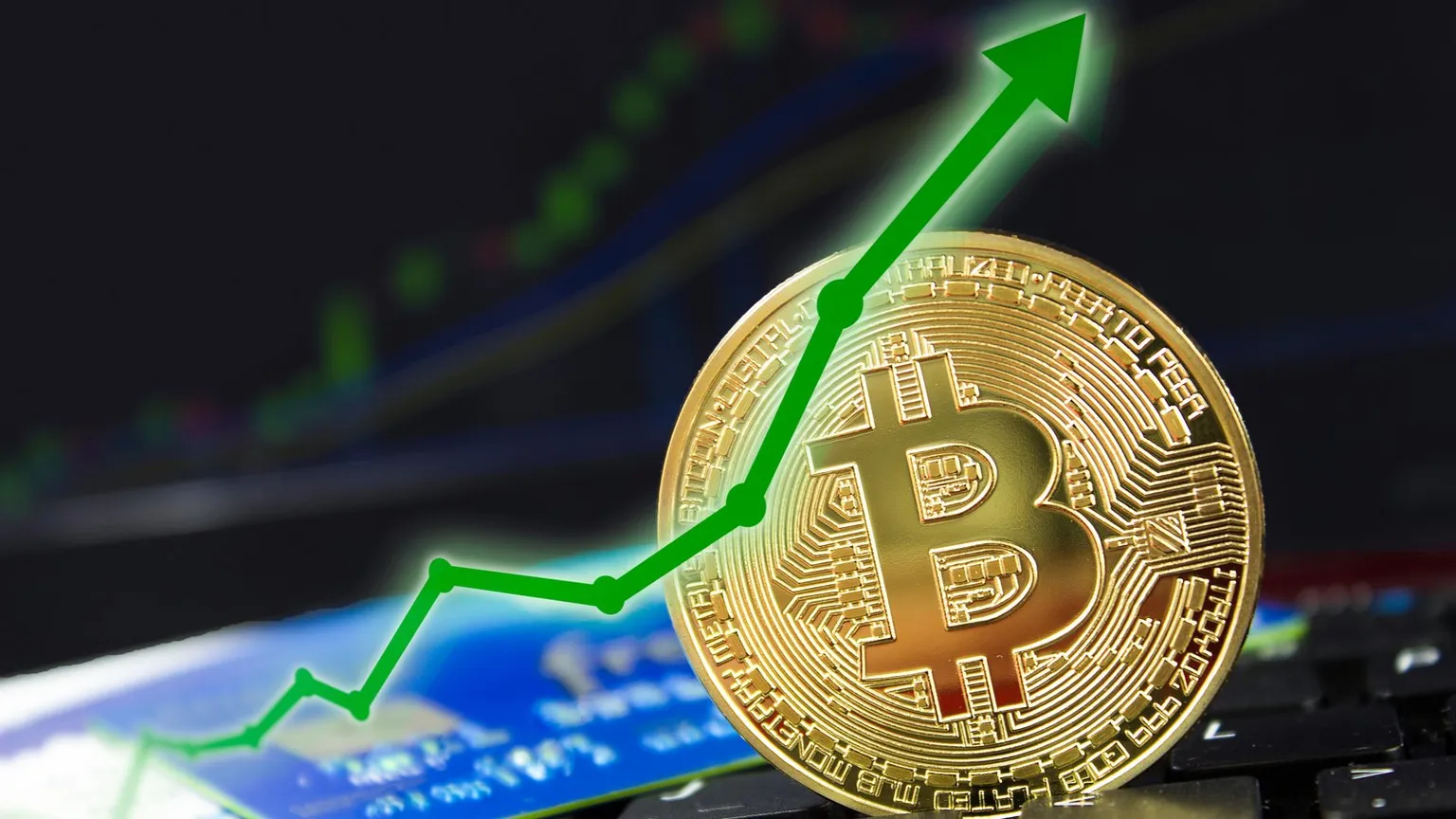 A gold Bitcoin next to a chart showing upwards market movement