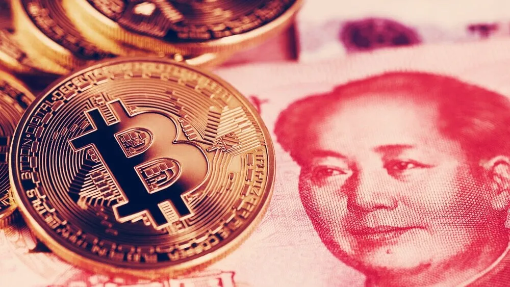 Bitcoin kept on a Chinese banknote. Image: Shutterstock
