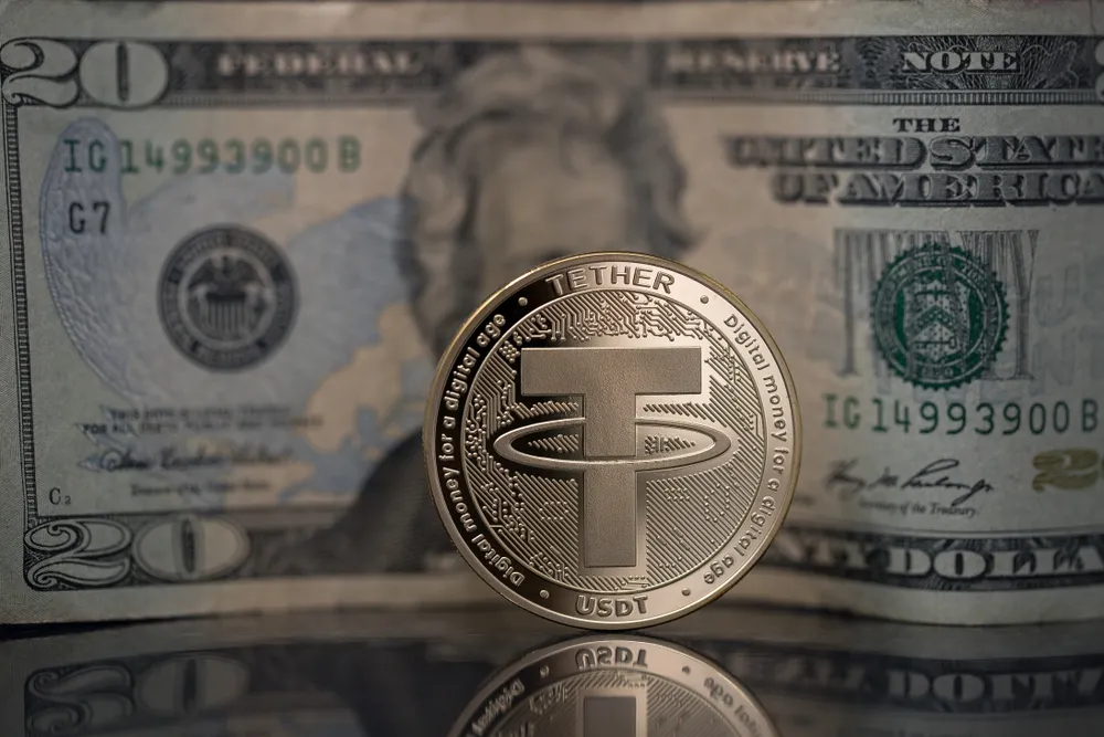 Tether coin in front of $20 bill