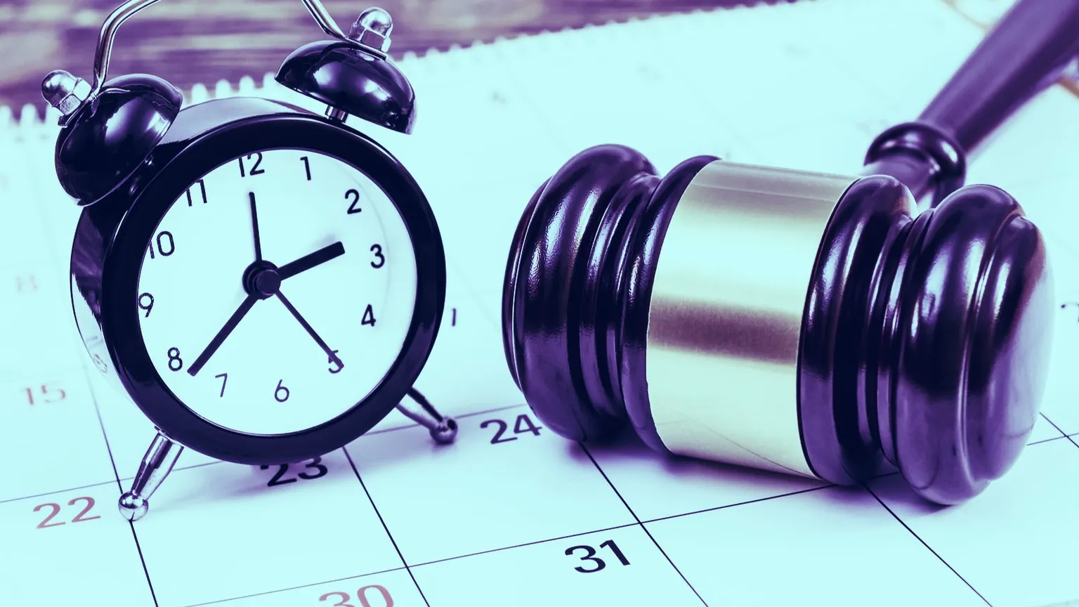 Judge's gavel with clock and calendar on the table. Image: Shutterstock