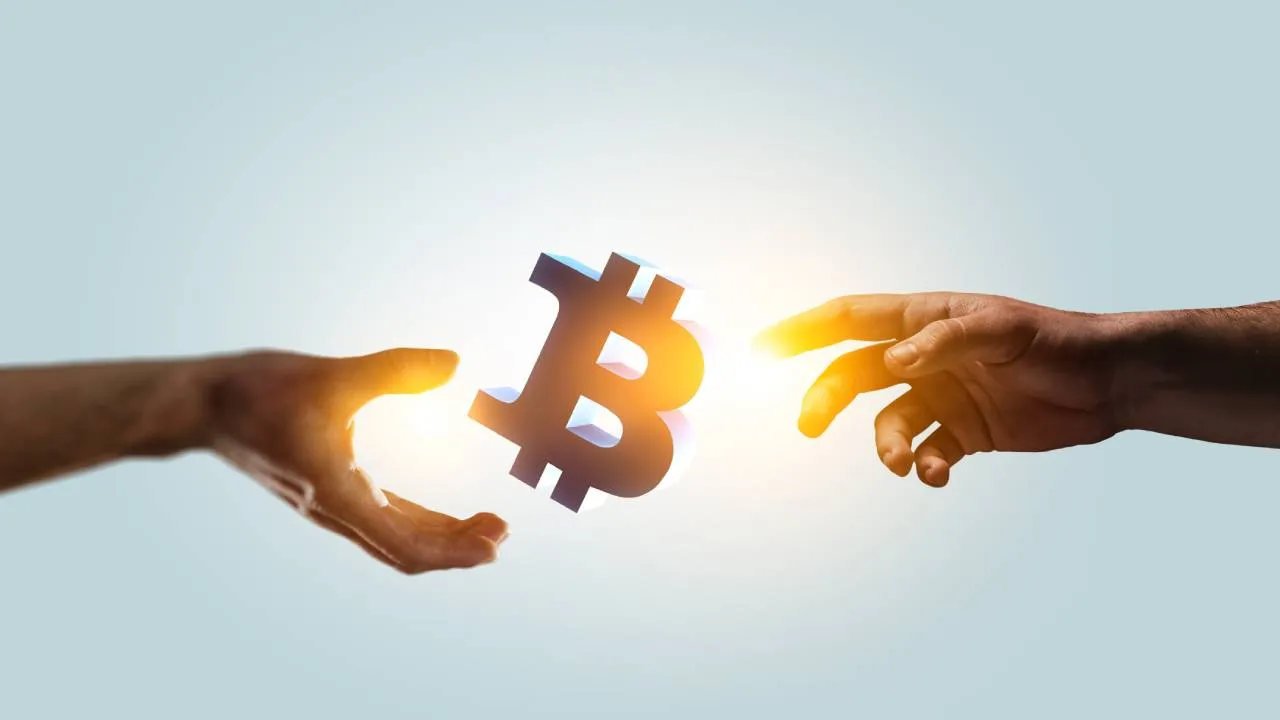 Bitcoin B between two hands