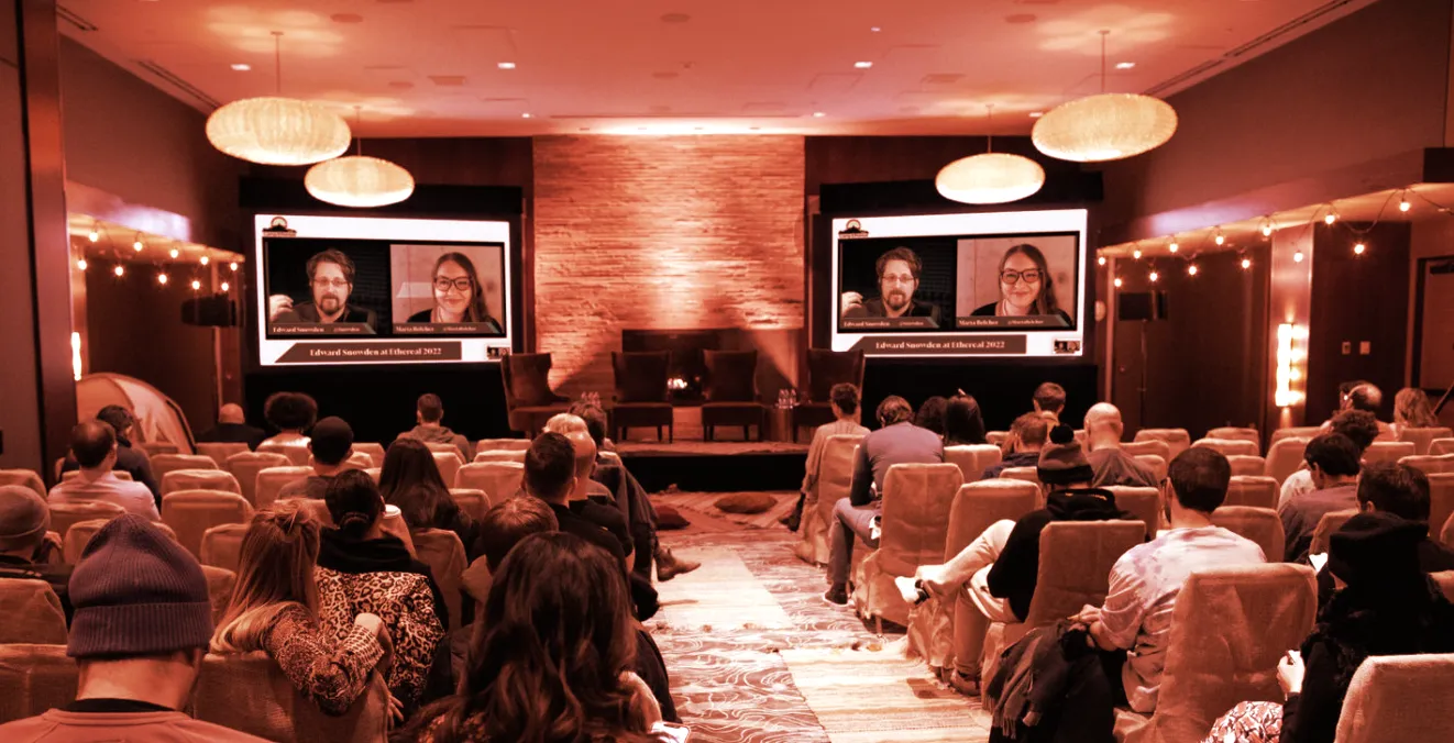 Edward Snowden's interview with Marta Belcher playing on screens at Camp Ethereal 2022. (Photograph by Chie Endo)