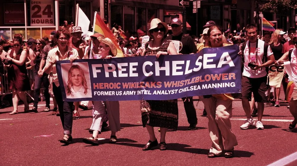 Supporters of Chelsea Manning carry a banner at the 2014 Gay Pride Parade in New York City. Image: Shutterstock