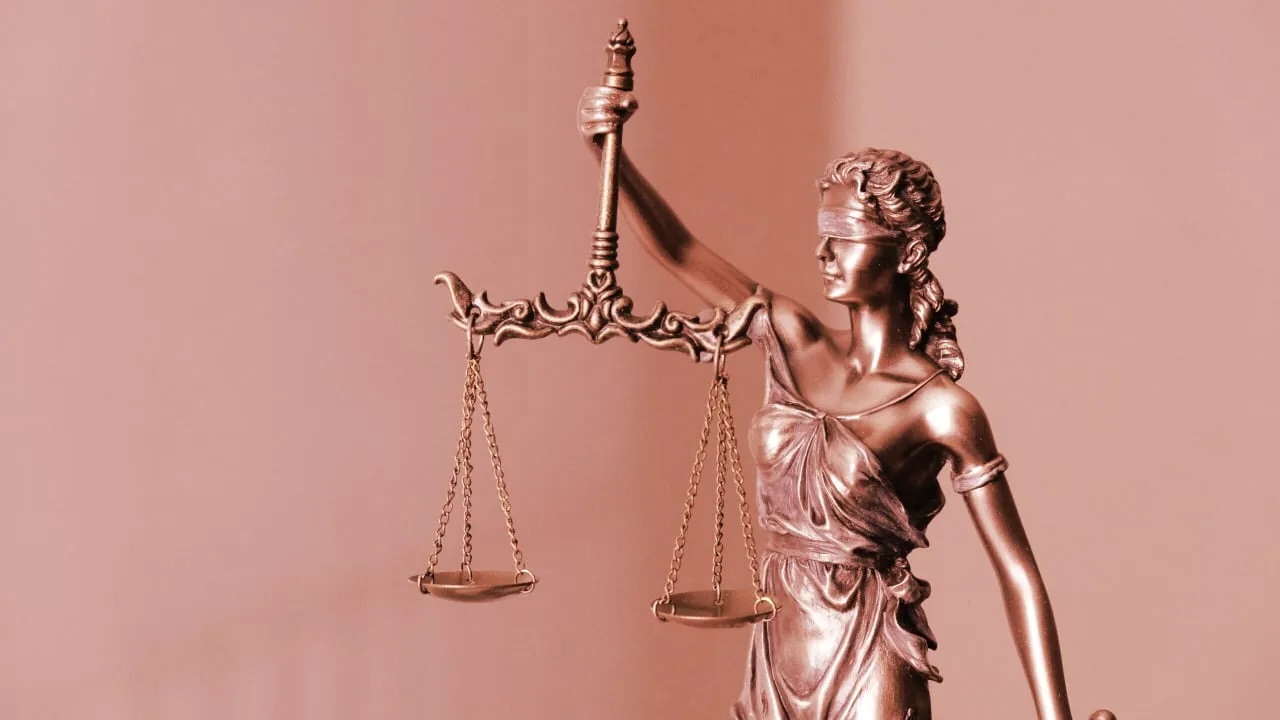 The scales of justice. Image: Tingey Law Firm on Unsplash.
