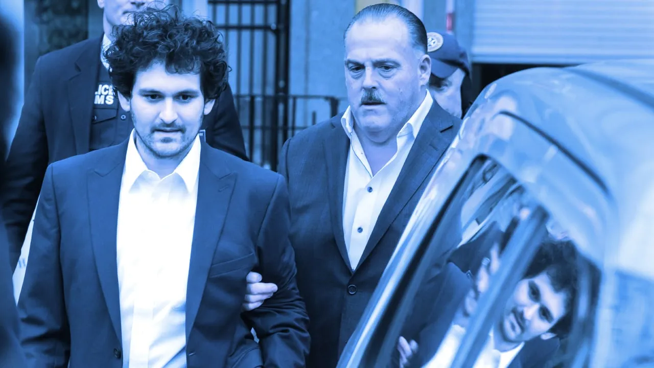 Mandatory Credit: Photo by JUSTIN LANE/EPA-EFE/Shutterstock (13681678l)
Cryptocurrency entrepreneur Sam Bankman-Fried (L) is lead out of an U.S. Federal Courthouse after being released on bail following an arraignment in New York, New York, USA, 22 December 2022. Bankman-Fried,  who was extradited to the U.S. from the Bahamas yesterday, is facing federal charges that he used money from investors illegally for personal gain.
Bankman-Fried Hearing in New York, USA - 22 Dec 2022