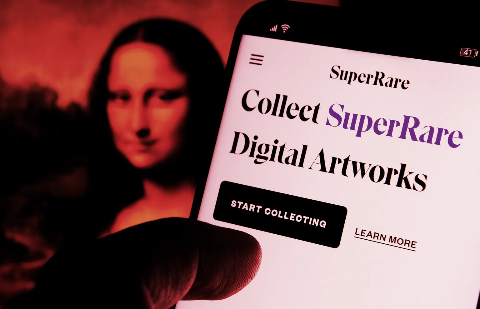 SuperRare digital artwork website seen on smartphone and Mona Lisa on a blurred background. Stafford, United Kingdom, March 31, 2021 (Shutterstock)