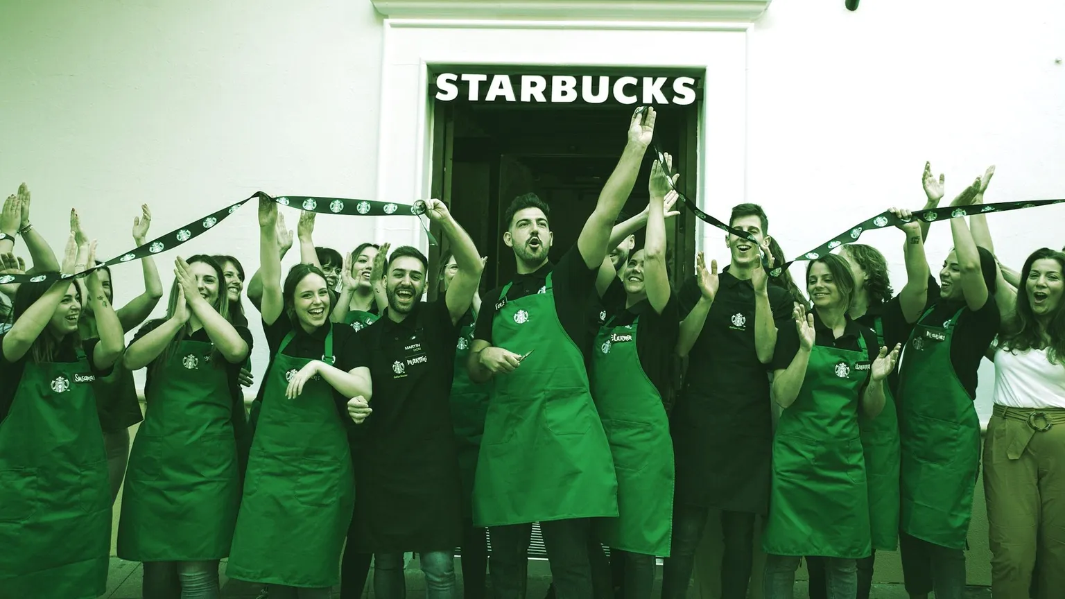 Starbucks staff celebrate the opening of a store in Cordoba, Spain. Image: 