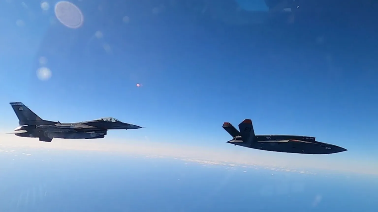 XQ-58A and F-16 Together in Flight Kratos XQ-58A