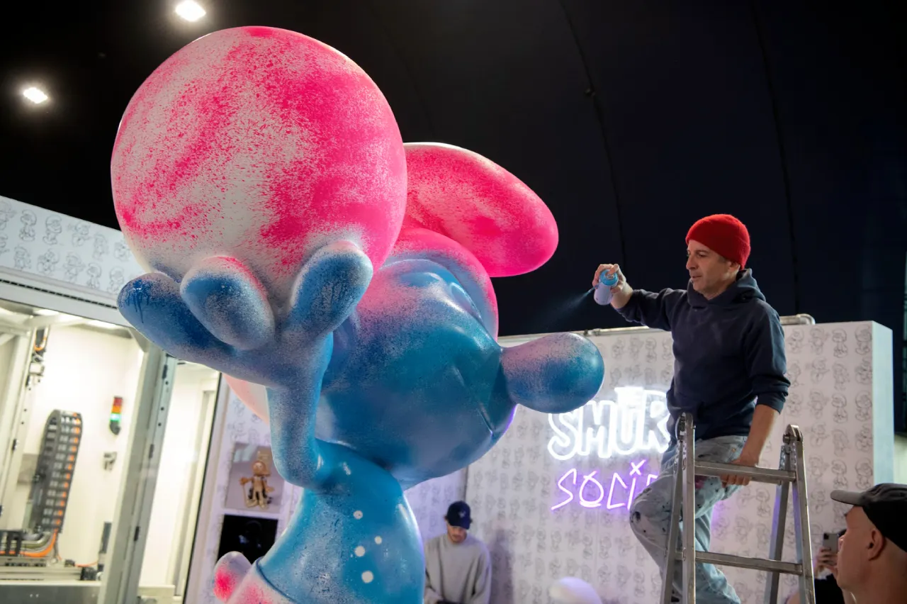 Man painting Smurf statue