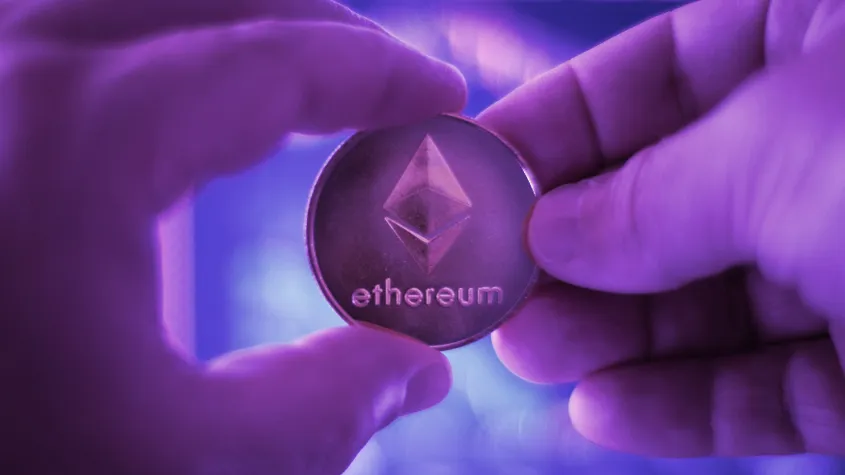 Someone holding an Ethereum token. Image: Shutterstock.