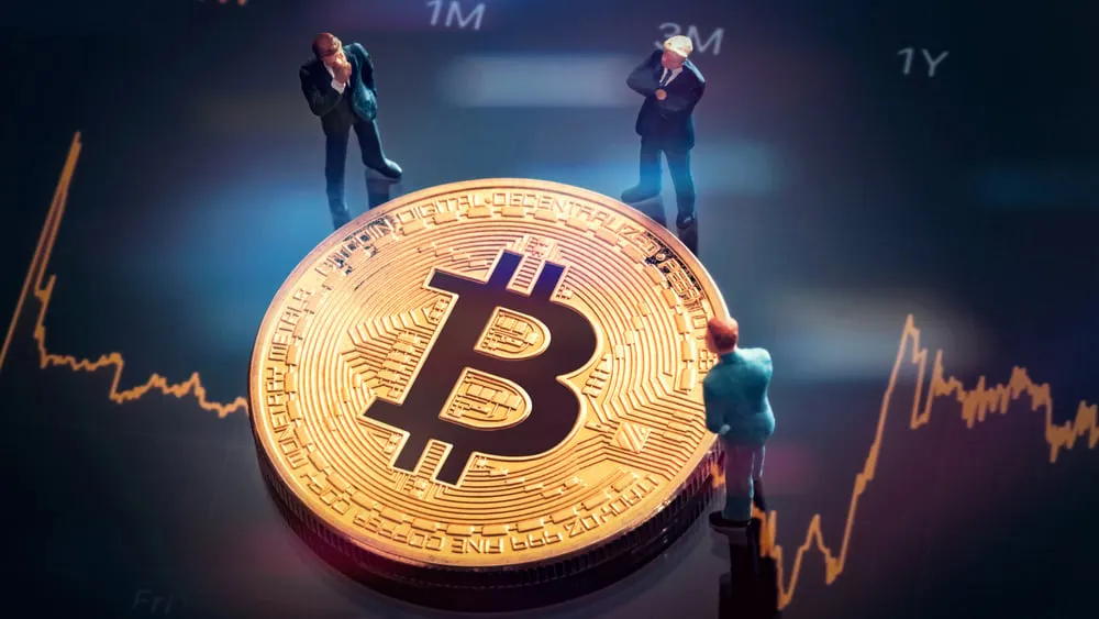 Three people discussing Bitcoin. Image: Shutterstock.