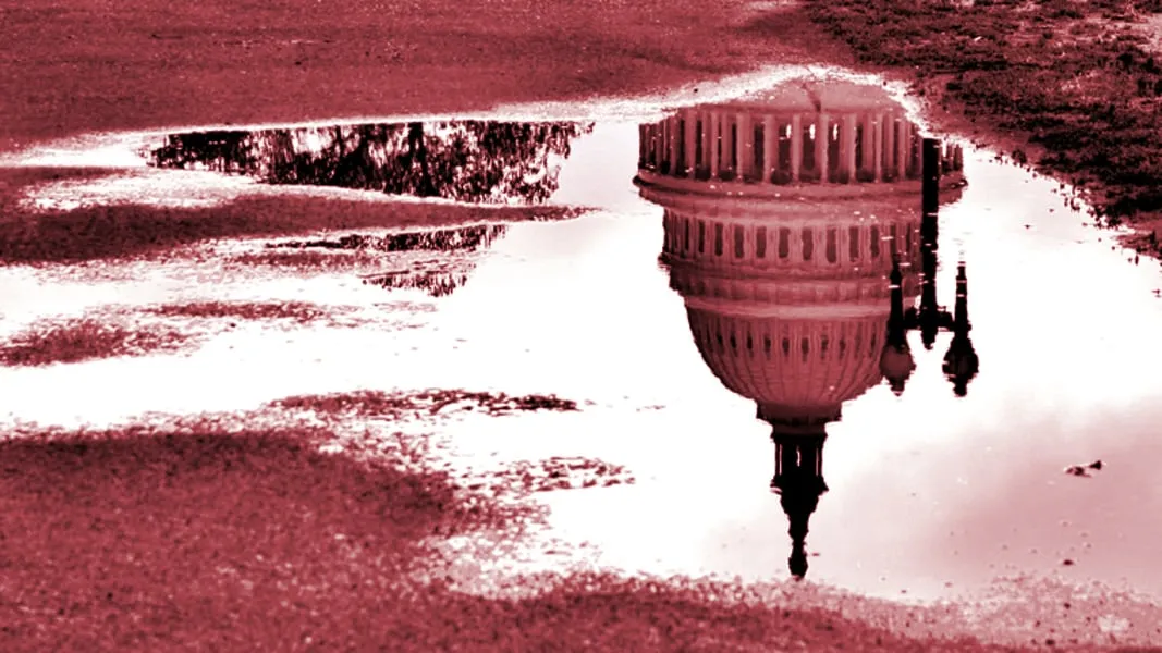Congress displayed in a puddle upside down. Photo: Shutterstock