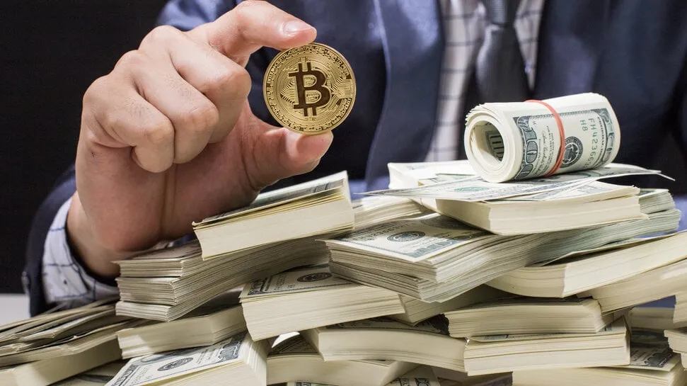 Bitcoin and a lot of money. Image: Shutterstock.
