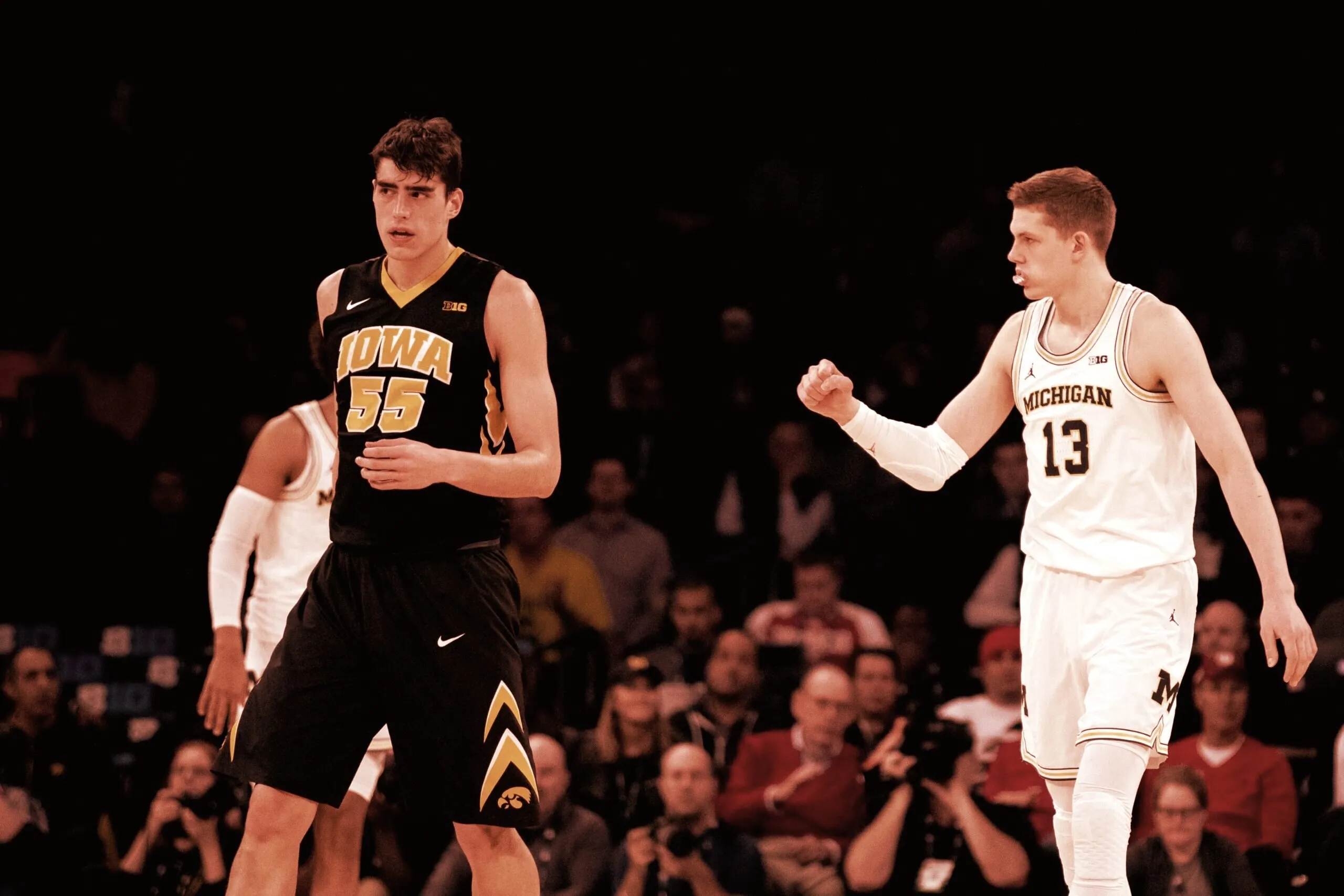 Luka Garza (L) and Moritz Wagner (R) in a March 1, 2018 Big Ten Tournament game between the University of Iowa and the University of Michigan. (Flickr user MGoBlog, CC BY-NC 2.0)