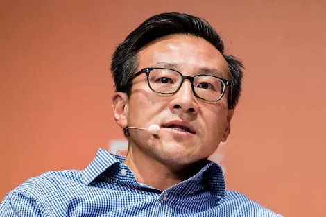 Image of Joe Tsai speaking at a conference.