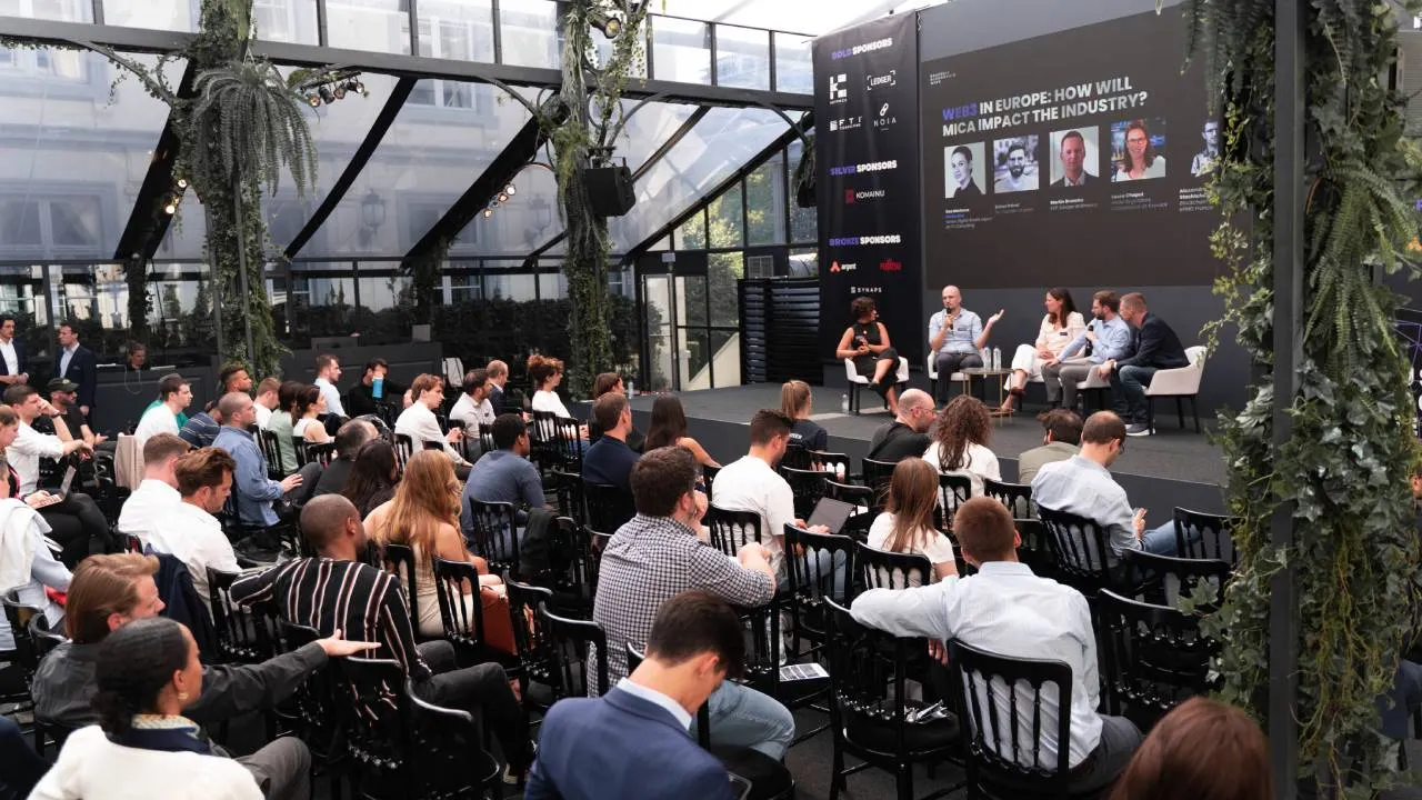 Panel of speakers on a stage