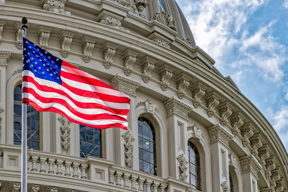 U.S. Capitol and Flag. Source: Shutterstock