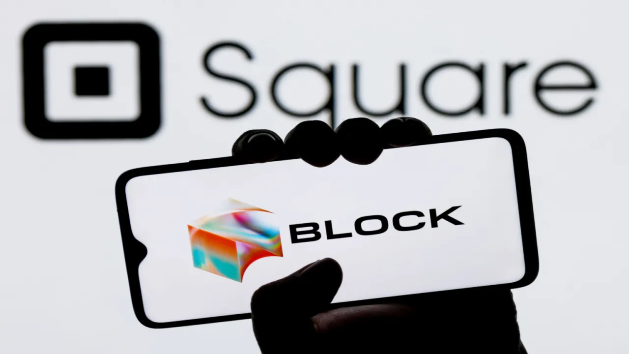 Block logo on a smart phone with the Square logo behind it. 