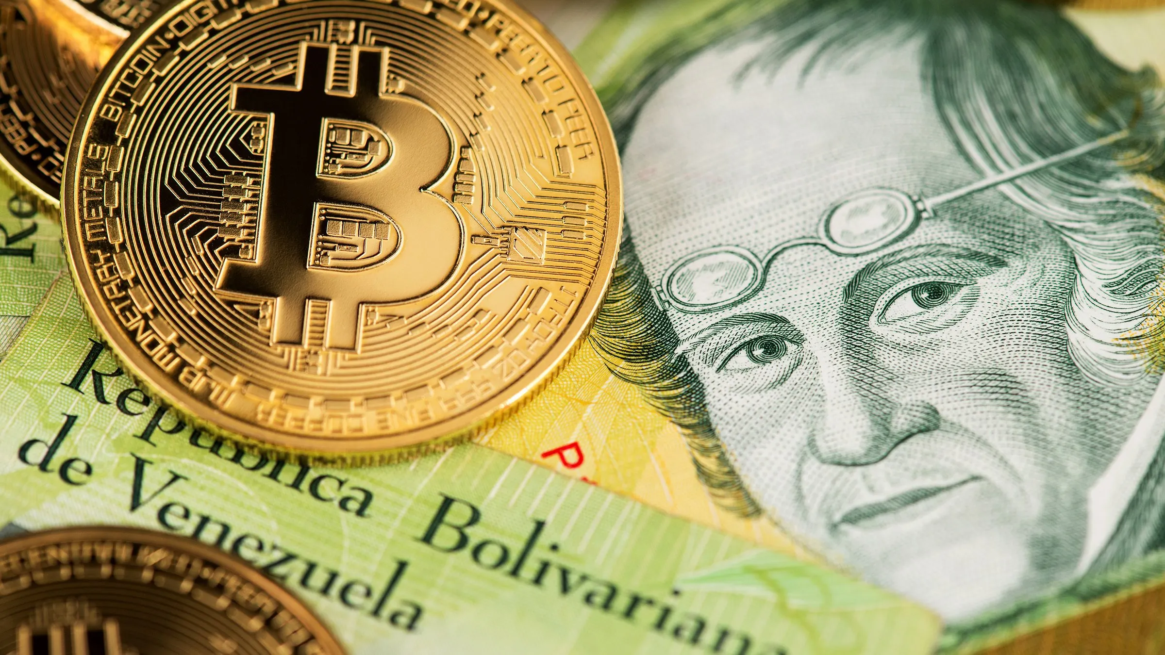 Bitcoin on Venezuela money Bolivar banknotes. Image: Shutterstock