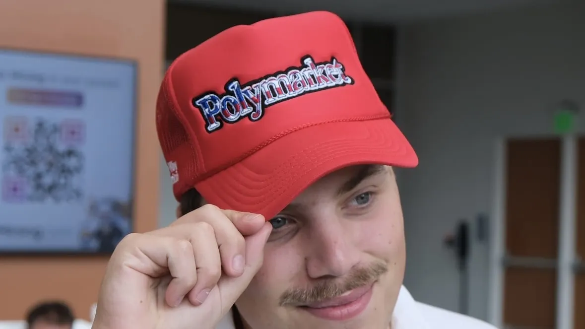 A Polymarket-themed hat given out for free at Bitcoin 2024. Photo: André Beganski/Decrypt