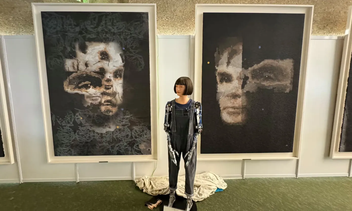 Ai-Da with the Alan Turing portrait. Image: Ai-Da Robot Studio