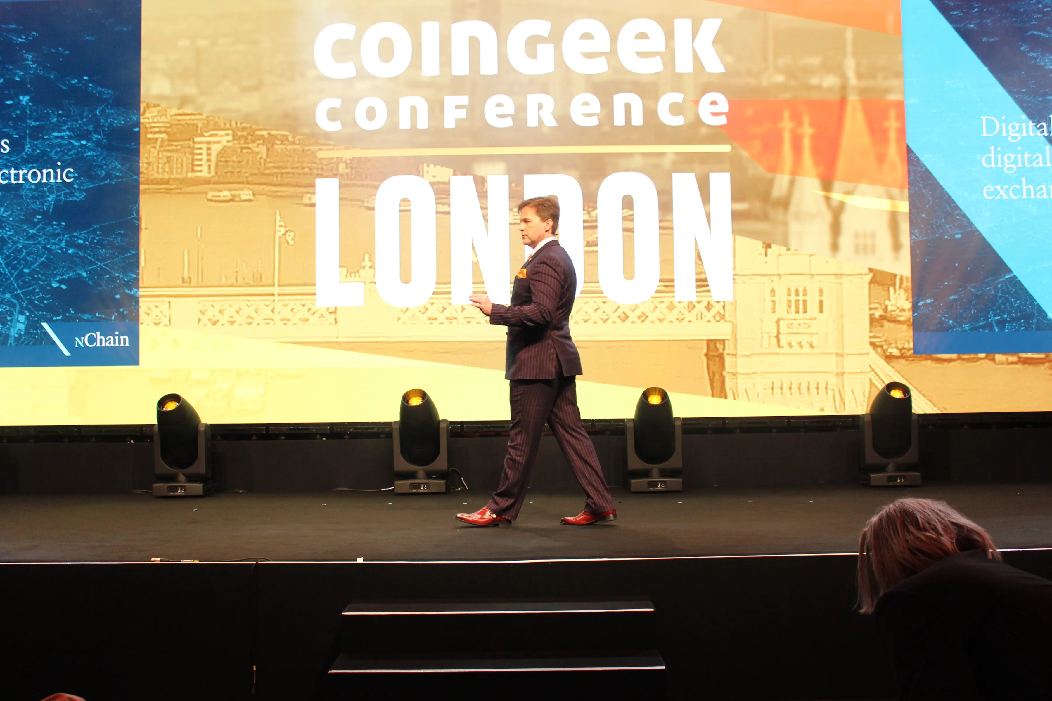 Craig Wright walking on stage