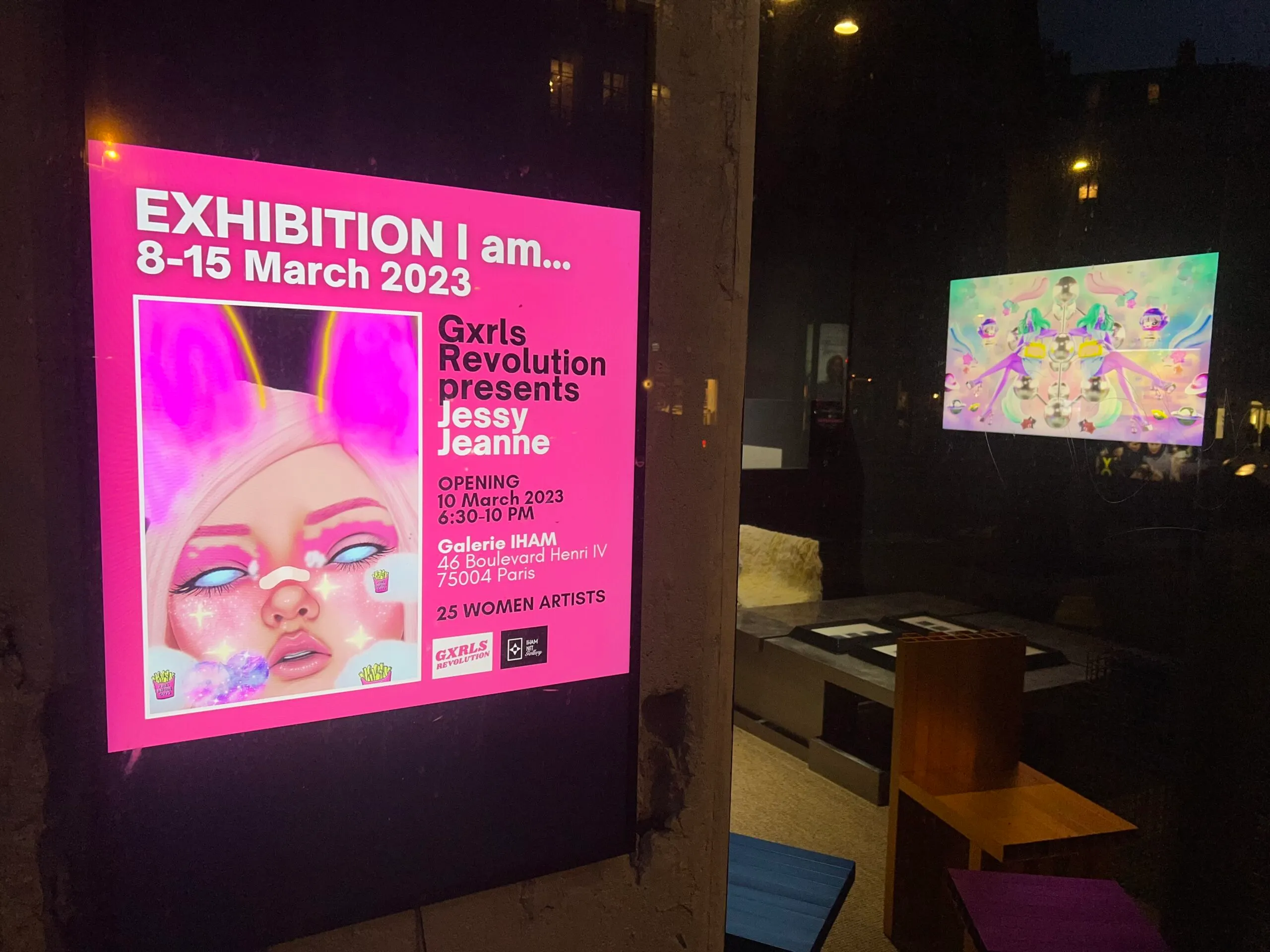 The entrance to an art gallery that is pink.